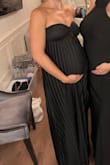 Perfect dress for my 8 month bump! Loved it. It stayed up super secure all night long. I ordered my true size (medium) even being pregnant, and it fit great. It was tight around the chest area, but that was ok because it stayed up. I'm not super big chested this might not be great if you have larger than a C. - Mackenzie