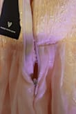 I was very upset with this dress. When I pulled it out of the package, several of the threads were loose, and the fabric was fuzzy. It only got worse when I tried it on, as the zipper was broken and wouldn't zip up. Very frustrating because it was a final sale, so I can't return it or get a refund. I am very upset with Lulus and will not be ordering dresses from them again. - Jada R.