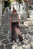 Funky fun top that pairs great with a white bralette. Well made and have survived multiple washes. - Kylie H.