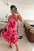 The dress is very pretty, and good quality. I am 5'4 and I needed the dress tailored to reflect the midi length in the image advertised. The dress is very long so it would fit better on someone taller in my opinion. I am also quite flat chested, so I had to alter the top, not the best fit for someone who is smaller chested. The breast panels need some weight to be properly held in place. The image I am provide is after it was altered, you can see the material is still gathered around the breast area. - Sarah R.