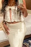 I wore this with the skirt as a set to a boho themed vacation dinner and it worked perfectly. The only top size left was small and I'm normally a medium but smaller chested so it worked fine. - Krista T.