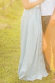This maxi skirt is a light breezy material. The waist runs a little large so I order a size down and it fits great! You can adjust a slit with the bottons.. or have no slit at all! Love this skirt. - Amanda I.