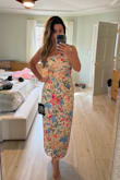 I purchased this for a baby shower and it fits perfectly! The fabric is amazing! Looks just like the pictures. It is a little small for a size small, but I would not personally go up in size. It's a little longer than I expected which was great for me because I didn't want a high slit in the front. I am 5'1 and 115 pounds. I wear a size 25 in jeans, small in most tops, 32D bra. I purchased a small. - Cherish R.