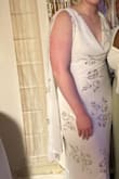 Originally bought this for engagement photos, but ended up wearing it to a Greek God/Goddess-themed party. It's SO fun to wear, with the flowy cape-things on the back and the draped front part. I will say, be careful with what you wear underneath if buying this in white. I was fine wearing whatever for sticky boobs/pasties since the drapery covered that, but the material is pretty thin overall, so most underwear or shapewear would probably show through. - Reese P.