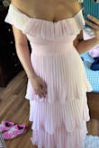 It's a beautiful dress, well made too. Little heavy, but I like the feel. Feels like an expensive dress. Size down if you like a snugger dress. I am normally a small, and I exchanged for an xs (wearing xs in the pic). It's a perfect shade of pink. It is very long thought so it will def need to be tailored if you're short like me. - Nina N.