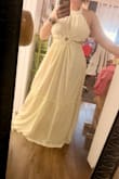 The ivory/ cream color is more of a yellow tone than ivory. The fabric is great, maybe not made for bigger busts, but I will manage.  A little disappointed with the color, is misleading in the photo to a more white color. Is light yellow not ivory. I will still keep it. - LUZ M.