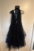 I purchased a dress to go to a wedding and don't want to attract too much attention!  I tried the dress on straight out of the bag and the level of "poof" was a lot! It looks nothing like the review photo which show the detail but it looks streamlined vs. Mine where the outer layer of the mesh/tulle is very puffy and less flattering that pictures as it makes me look much larger!  I'm not sure if it just needs to be hung so the material "falls" after period of time? I'm not sure I want to spend another $100 for a seamstress to cut out a bunch of the Thule but the photo of me in dress has an handful of material clipped behind my back to what I would want it to look like/ hanging dress shows the "volume"
Did I end up with double material or can this be salvaged? Not going to a prom!
Any thoughts? - Kate T.
