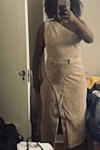 This is a fabulous piece. My husband asked if I had it tailored for me! The Jean material is heavy duty! That being said, it's more of a shoulder season dress (Spring/Fall). The skirt slit is sexy! And the shoulder pleats are classy. This dress has NO stretch so if your breast and hips aren't located where the darts are then you're screwed. Luckily mine are! Can't wait to wear it!! - Tolonda T.