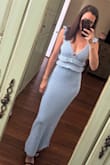 Fits true to size. Super comfortable. The material is really nice. I actually saw this exact dress on another website higher priced. Good quality cute dress. - Christin D.
