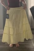 It's very pretty, but the skirt is very wide and has more volume than what appears in pics. Also, too long for shorter women because it was touching the floor even when I placed it at my natural waist. It made me look much bigger than I am which was sad because I really loved the color and style. - Karen S.