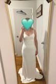 I was obsessed with this dress when I saw it online. I really thought it was the one, so I'm disappointed to have to return it. I was shopping for a city hall wedding, so I didn't really have super high standards in the first place. The main issue I had with it was the weird white stripes in the bodice. This made the dress look weird and cheap. Since the dress is lined, there was also some weird small bumps in the chest area that made it look like I was nipping even though I had a bra on. Finally, I have a wider waist/thigh. The dress is very tight in this area, which could make shapewear potentially difficult. I ended up returning this dress. Can't say I recommend it tbh. - Brenna F.