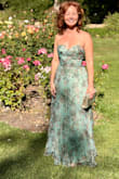 Absolutely loved this dress! The fit was nearly perfect right out of the package. I only needed to have it hemmed because it was a bit too long for me. The alteration cost a little more due to the multiple layers, but it was well worth it. The lace-up back is a wonderful feature because it allows you to adjust the bodice for a more customized fit. The material feels high-quality, substantial, and elegant without being too heavy or uncomfortable. I received compliments on the dress before I even made it to the wedding, and the compliments kept coming throughout the event. It was comfortable to wear, flattering, and made me feel confident all night. I would definitely recommend this dress! - Alina K.