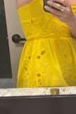 It's super cute on and I did order a size up like other people had said. Before I even wore it, the dress started to fray all over. Then I wore it for 5 minutes and there is already a rip in one of the seams. It's cute but not worth the price. - Rachel A.
