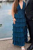 Heavier dress with what feels to be, quality stitching and fabric. This dress was super long for a 5'3" gal like myself, so I cut off a full tier. It was a simple fix to avoid wearing 6 inch heels and it was totally worth it. I received so many compliments on this dress, I'm so glad I purchased it! - Laurie Y.