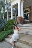 Hi bought this for my 30th birthday and it was absolutely stunning! The fit was perfect and the upper band has a comfortable stretch. The dress pattern is a gorgeous butter yellow and compliments tan/dark skin tones beautifully. I am so thrilled with the outcome and it was the perfect way to ring in 30! - Lianna S.