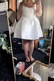 Cute dress and it did 'fit' but was a little tight and the chest area and I'm a 34 B. Very difficult to breathe and would need to size up. - Rachel R.
