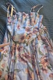 The corset top is off-centre from the bottom. It looks crooked. I won't be trying a new one, the return cost of shipping from Canada for 3 dresses is $35 and I still don't have a dress. Brutal. - Kate T.