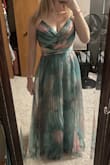 Wedding guest dress- perfect for the ceremony and dance floor. I followed the measure guide- I was on the top end of the M sizing, and lower end of the L sizing- I ordered an L to be safe, and it was WAY too big. I didn't have time to run an exchange so I altered it myself- I took 2.5" off the waist (moved the invisible zipper tapes), 2" off the bust (removed and reattached the visible zipper) and 3.5" from the lining and top fabric. The top fabric is a DOOZY to measure and sew since its so floaty and fine, and on the bias most of the way. If you have someone hem it, tip them extra!! I did an overlock stitch. The fabric is also shimmery- I couldn't tell that from photos! 

I wish the top fabric laid flatter at the waist, it poofs/rides up and made my waist look bigger than it is. Couldn't ironing bc of pleating. The right strap broke where it attaches to the top bust triangle- it lasted through about 90 minutes of hard dancing, though! I'll fix it and definitely rewear! - Chloe W.