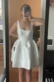 I'll definitely have to get it altered since the top is a little loose on me, but it's not too short and I love it! - KATIE A.