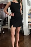 Fitted all around with a bit of wide shoulder straps, but still remains fitted. The dress material is thick and stretchy. I could've done a size M for a tad bit more room in the waist area, but I don't mind the fitted look. - Niki C.