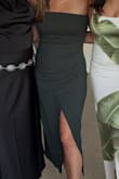 This dress was super flattering, and I got many compliments. The material is comfortable and has some stretch to it. If you're in between sizes, I suggest you size down. It fit a little too loosely, and I was pulling it up by the end of the night. - Lacey B.