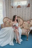 I should have read the reviews and sized up the dress, but fortunately for me, altering it with a corset back was possible. Other than the back, the fit was incredible, and the cut of the dress has you feeling absolutely beautiful. I was so excited to wear this on our special day and love how it photographed. Could not recommend this dress enough! - Juliana L.