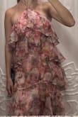 Beautiful fit, and looks stunning with movement (walking, or with some wind). Has a lot of give in the mid-section, and isn't too form fitting to the waist region. However, all the weight of the dress is on the string that ties around the neck, which is pretty uncomfortable. Could be feasible for a 1-2 hours, but for a wedding, it was too uncomfortable. Additionally, you'd have to be cognizant of the chest region, as the sides can slip towards the center of the dress. I found myself frequently re-adjusting them, pulling the sides of the chest area out to ensure I was covered. - Emma B.