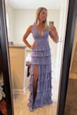 This dress is so feminine and fun! The material is heavy!! Feels much more expensive than it was. I loved the swishy movement of the tiers. The back was not my favorite style - a little bit like a backpack, it's too much going on. The length was perfect. Overall I felt great in it! - Kristen C.