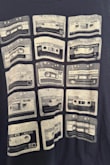 This top is super cute. I'm 5'6 135-138 pounds 36C. The medium fits perfectly. Fun, retro look for a casual day. I took one star away because the photos with the model show the cassette tapes are white or gray. They're actually gold which is not what I wanted or the color I was looking for. So there's that. Just a heads up if gold is not in your plan. - Julie H.