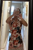 I love this outfit and it gets compliments. If you are torn between sizes go a size up. It is short, but not inappropriately so. I wear it tied behind the neck and feel great in it. - Sharan R.