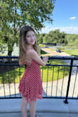 This dress is adorable! The tie straps and back make it super easy to achieve the perfect fit. There is just the right amount of flounce with the layered skirts. It is super easy to wear. Very comfortable. So cute. It's perfect for a summer party, graduation, or dance. - Chaaron P.