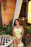 This dress is so cute and perfect for a formal dinner or formal occasion. Love the open tie back. Love the satin and doesn't show the stomach how a lot of other satin dresses tend to do. Wore with heels and was perfect height I love this dress for the price. I ordered an extra small and am usually small so maybe size down but you are able to tie in the back to fit to your size. - Skyla C.