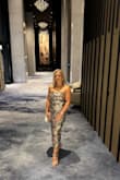 This dress fits flawlessly in all the right places! It's the perfect midi for an elegant date night or a summer wedding. I absolutely love the vibrant colors! I paired it with a gold strappy sandal and a gold flower stud earring. I received so many compliments! - Dena B.