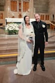 I ordered the Arienne dress and couldn't be happier. Since my new husband is on a 90 day fiance visa, we planned our wedding on short notice. The dress arrived in less than a week, neatly packaged with a new, complimentary garment bag. Despite being shipped in a box, the dress didn't need to be ironed or steamed before the big day. I'm 5'5 and with 2 1/4 inch heels, I didn't need the dress hemmed. I was a little nervous about the off the shoulder strap/sleeves being too tight after reading some reviews, but I found them to be comfortable and not at all restrictive. The dress is incredibly comfortable and forgiving but very, very form fitting. I wore Honey Love under the dress, but I'm seeing pictures where I can still see outlines of things (like my belly button) I'd rather were invisible. As I read in reviews the V does tend to flip up. Because I was short on time, I used fabric strips to keep it down (which came right off when I wanted them off) but otherwise I would have had the V sewn down. - Kelly K.