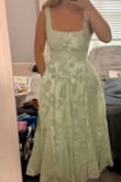 I ordered six dress options for my brother's wedding and my family and I voted that this was the winner! Love the adjustable corset back and the POCKETS! I can keep my phone and lipgloss with me all day. Love the light sage green color, how fitted and smooth the top is and the option for no bra. The bottom poofed out in a flattering way and I'm going to pair it with gold shoes and jewelry. So excited I found this dress! - Bluey B.