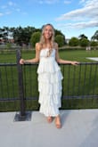 I ordered this dress for my rehearsal dinner, and I was a little scared since there weren't any reviews yet, but I am so glad I took the chance! It was absolutely stunning and fit me perfectly! I love the ruffles and dots as they added such girly features to the dress!! The zipper was a little tricky and kept getting stuck when I put it on, but once it went, it was beautiful! It was also a little longer on me than I expected, but I am on the shorter side (5'3"), and I loved the way it looked regardless! It is double-lined, so it was not see through at all, which is great when shopping for white dresses. - Kami F.