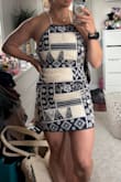 I like it, but I don't love it. I'm somewhere between an athletic and curvy build, and this material has ZERO stretch or give to it. I'm keeping the dress for my trip to Greece, but I wouldn't say it's the most flattering fit on my body type. - Sarah K.