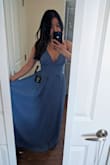 This dress is so beautiful!  I tried both the Small and Medium and while I could just fit into the Small (I could barely breathe lol!), the Medium was basically the same everywhere but with more room in the waist.  The Medium ended up fitting perfectly!  I'm 5'2" and with ~4inch wedges, I still have to go get it hemmed, but I'm pretty used to that.

The color is a gorgeous dusty blue and true to the color in the picture provided on the website.  I'm planning on wearing to a spring wedding as a guest in May and I think it'll be perfect!  I'll definitely get multiple wears out of this dress.

The low neckline is very flattering without being too revealing.  And the material feels  high-quality. - Amy M.
