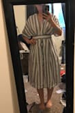 I love this dress. I was shopping for a dress to wear to a wedding, this is not it but It's so cute that I am probably going to keep it anyway! It's linen and has a lining. The top is a bit big. Again, wish I had bigger boobs. There is a zipper and a tie. It was A bit tight where he tie tied around my ribs but I think it would Be too big if I went up a size. The back is very open. I only wished it had Pockets. Maybe not the most flattering thing now that I look at it from The back, but I don't care! - Wendy M.