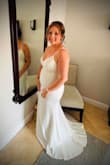 Ordered this for our destination wedding in Jamaica. I ordered a medium, and it fit extremely well! It traveled beautifully; I didn't have to worry about wrinkles at all. Was light enough that I wasn't completely dying in the heat at the end of June, but heavy enough to withstand the ocean breeze. - Stormy S.
