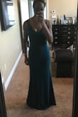 I love this dress! The color is really nice. I'd call it almost like a realist kind of green, and it really pops on most likely any skin tone. The fabric is pretty have but seems like it's not cheap at all and would last a long time. The dress is also a little wide around my hips but other than that it fits true to size. It even goes down to the floor and I'm 5 ft 10 in so that was a definite plus. 10/10 recommend for a formal event!! - Olutomi A.