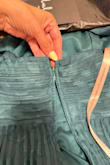 Just arrived, upon unpacking noticed the zipper up and open. Beautiful dress but cheap zipper , what now? I got this on sale - Luzmaria V.