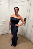 I loved this one me, just as much as I loved it on the model! I think it's very true to size. It's long, so I will definitely get it hemmed. The bodice has great stretch. For someone with a wide ribcage, I don't feel uncomfortable or sucked in at all, and I can definitely move around in this. - Julia B.
