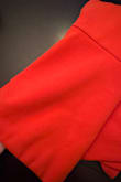 Dress pictured is a bright almost coral orange - actual dress is a darker red orange. Fabric is also very thick- not a summery dress. Would be great for a fall event. - Nicole W.