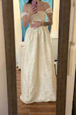 This dress is absolutely stunning! I picked this as my wedding dress and couldn't be happier. I expect to do some hemming, as I am very flat-chested and the top does not hold up on me, so I will need to get the bodice taken in. But length-wise, I am 5'3 and in 3-inch heels, and the dress just sweeps the floor. It's perfect! I ordered an XXS! The sleeves need to be taken in, but I am very small, so I expected to have to get it hemmed! - Skye P.