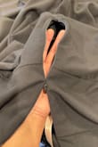 It's a beautiful dress, but I didn't even get to try it on & the zipper was hard to open, and when it finally opened and zipped it back up, the zipper split. Tried fixing it, but it's stuck. I can't return because it's not eligible for returns. - Nancy C.