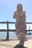 I wish these dresses came in smaller sizes and had lower backs. A lot of extra material and very long for my 5'3 frame. - Megan M.