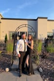 I wore this dress to my cousin's black tie wedding on the 4th of July! It fit great and didn't move at all during the night. I was concerned that being strapless would cause it to slide during the night, but the tight corset held it in place all night. - Kaitlyn K.