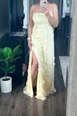 This dress definitely has potential. It truly is beautiful. I was excited about this dress but I was short on time so I ordered this dress in a Large after viewing the sizing. The dress fit perfectly on top in the bust area but the waist was very loose. There was a flower in the front on the bust line that was very oddly sticking up. I would've fixed it if I had wore it in the wedding but I chose another dress and returned this one. I think the Medium would've been a better size for me. This dress is extremely long too so if you are about my height you will need to make alterations to the length, even with heels on. For the tall girlies, this will be a great option for you! - Tiffany T.