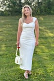 The material of the dress is thick and has a lining that prevents it from showing through. It perfectly emphasizes the figure! - Nataliia H.